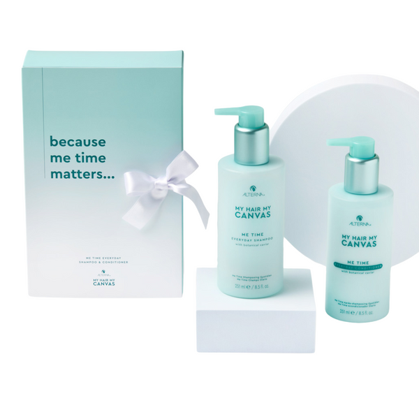 Two bottles of 'My Hair My Canvas' hair care products with a box on a white background